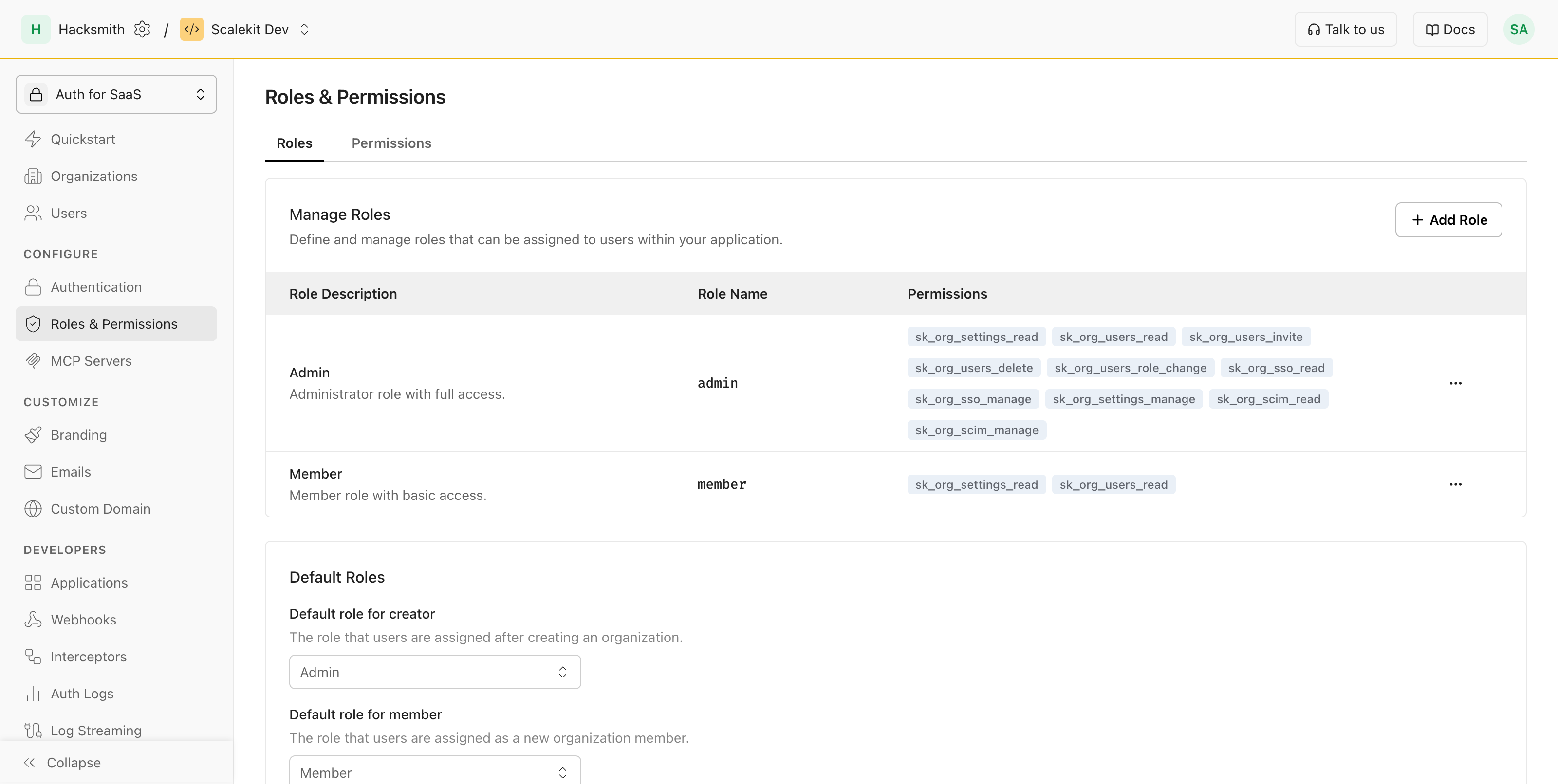 Scalekit roles list showing default and custom roles